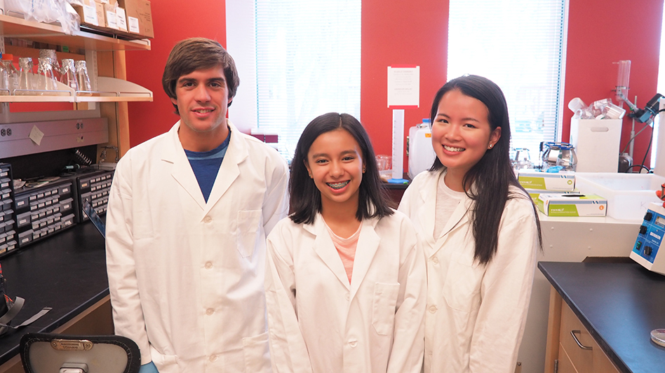 A KEYS intern (center) with her lab staff mentors. Credit: Alex Zhao