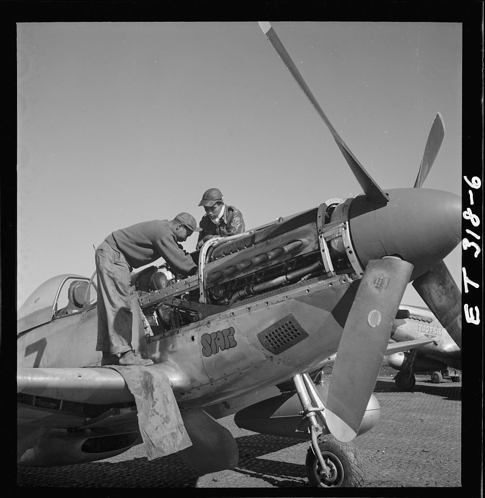 Airmen repairing a P-51 Mustang