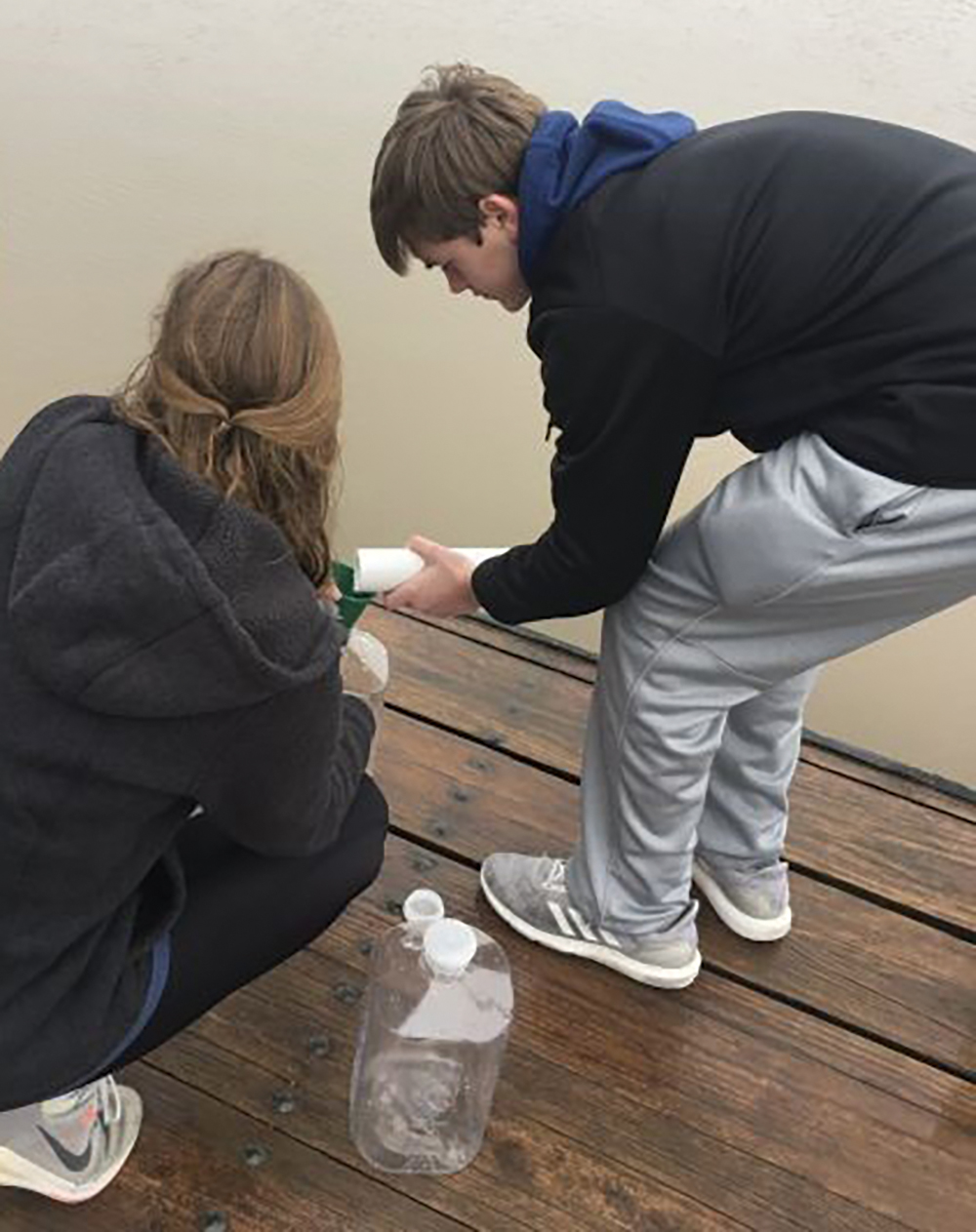 Students sampling water at the local reservoir.