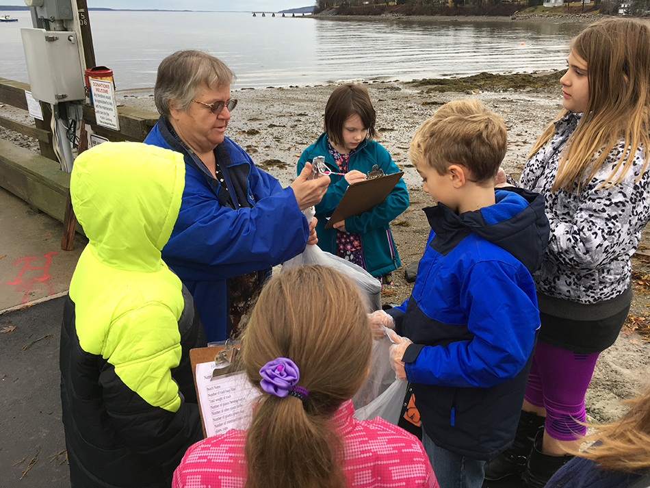 Students collect data at the beach.