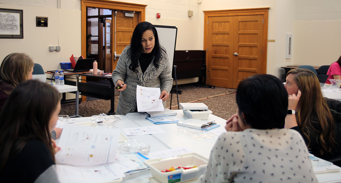 STEMpact facilitator V. Barbara Pener leads a session on Legos in the classroom for Level 1 and Level 2 members of the City of St. Charles School District STEM Leadership Academy