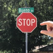 Stop Sign with Thumb and Forefinger to Measure