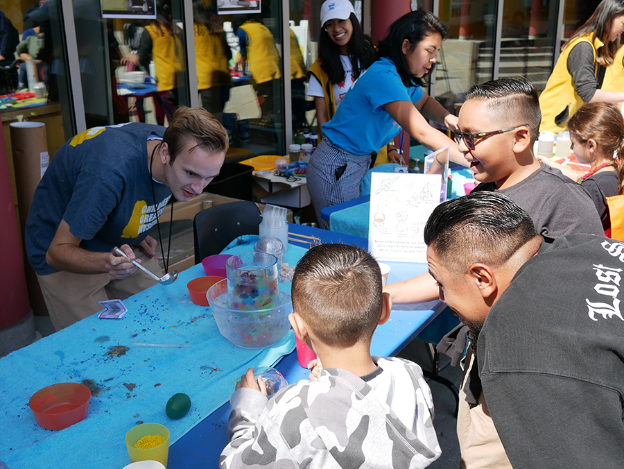 Visitors at the Children’s Creativity Museum simulate the formation of a nebula in space by mixing hot wax and other objects in ice cold water.