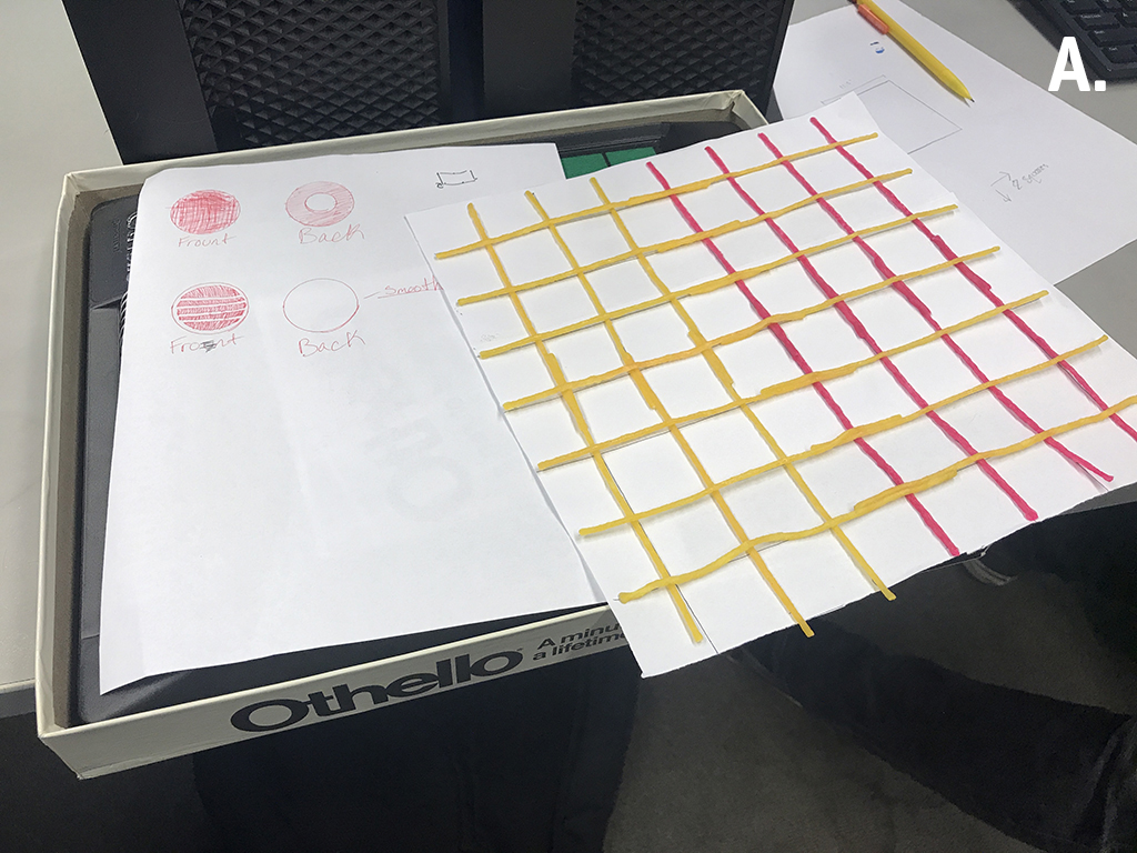 Early prototype of a tactile Othello board game designed by middle school students, including sketches of tactile game pieces and a tactile game board created with paper and Wikki Stix. 