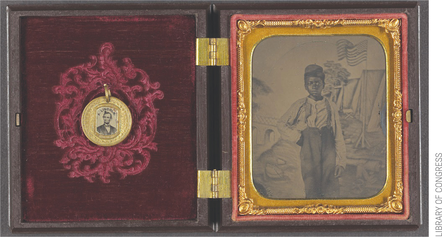 Unidentified African American boy standing in front of painted backdrop showing American flag and tents; campaign button with portraits of Lincoln on one side and Johnson on the opposite side are attached to inside cover of case. Both date to the period 1861–1865. https://www.loc.gov/resource/ppmsca.36463/