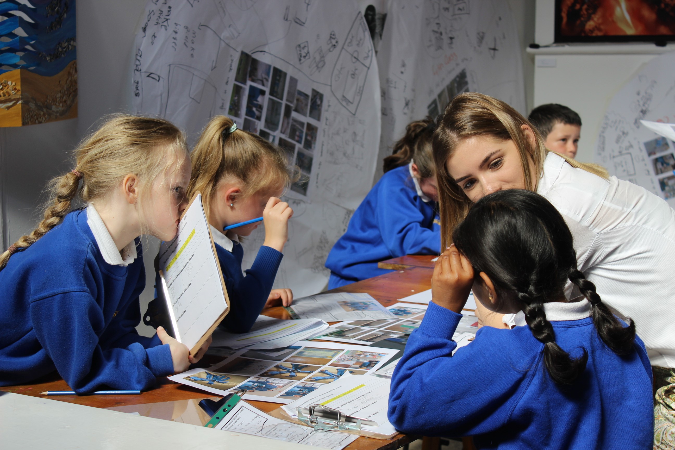 Figure 5. The STEAM committee examining empathy sheets and circular drawings completed by every child in the school