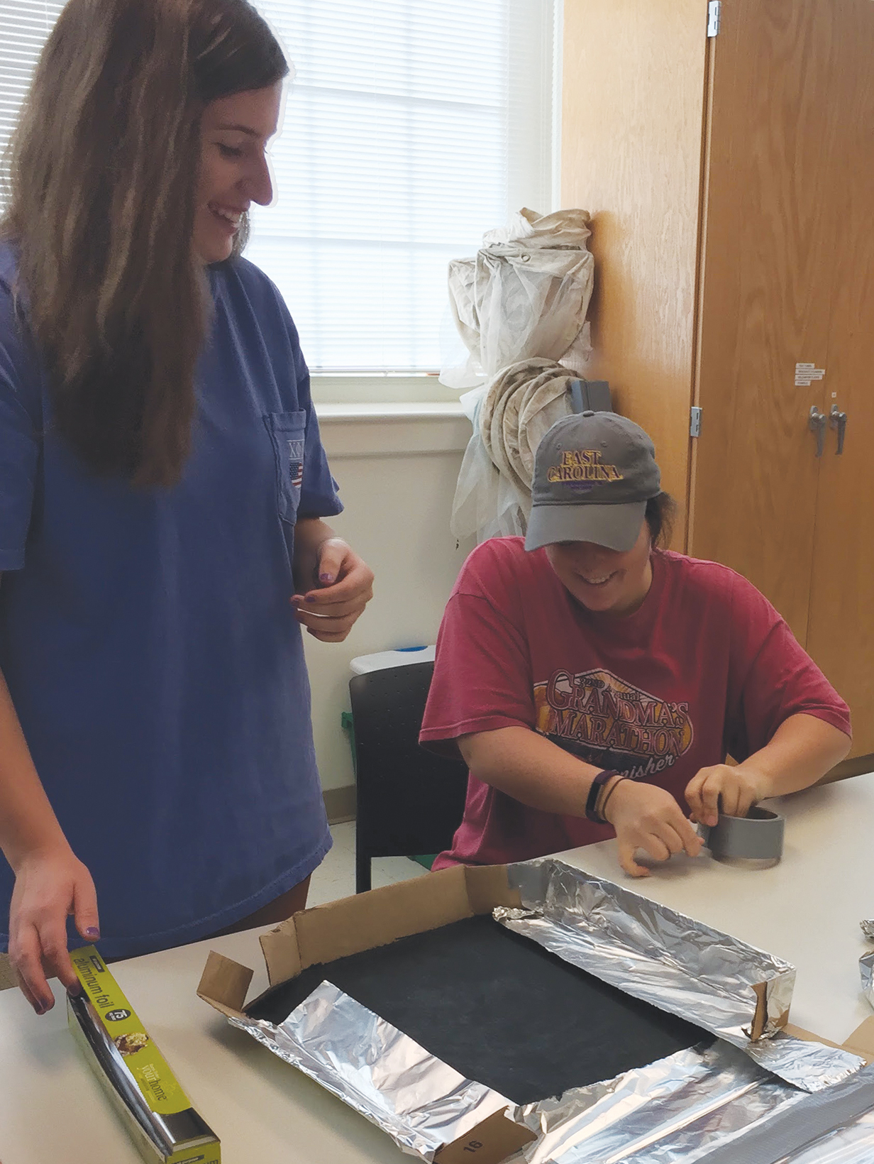 Elementary preservice teachers redesigning solar ovens. Photo courtesy of the author.