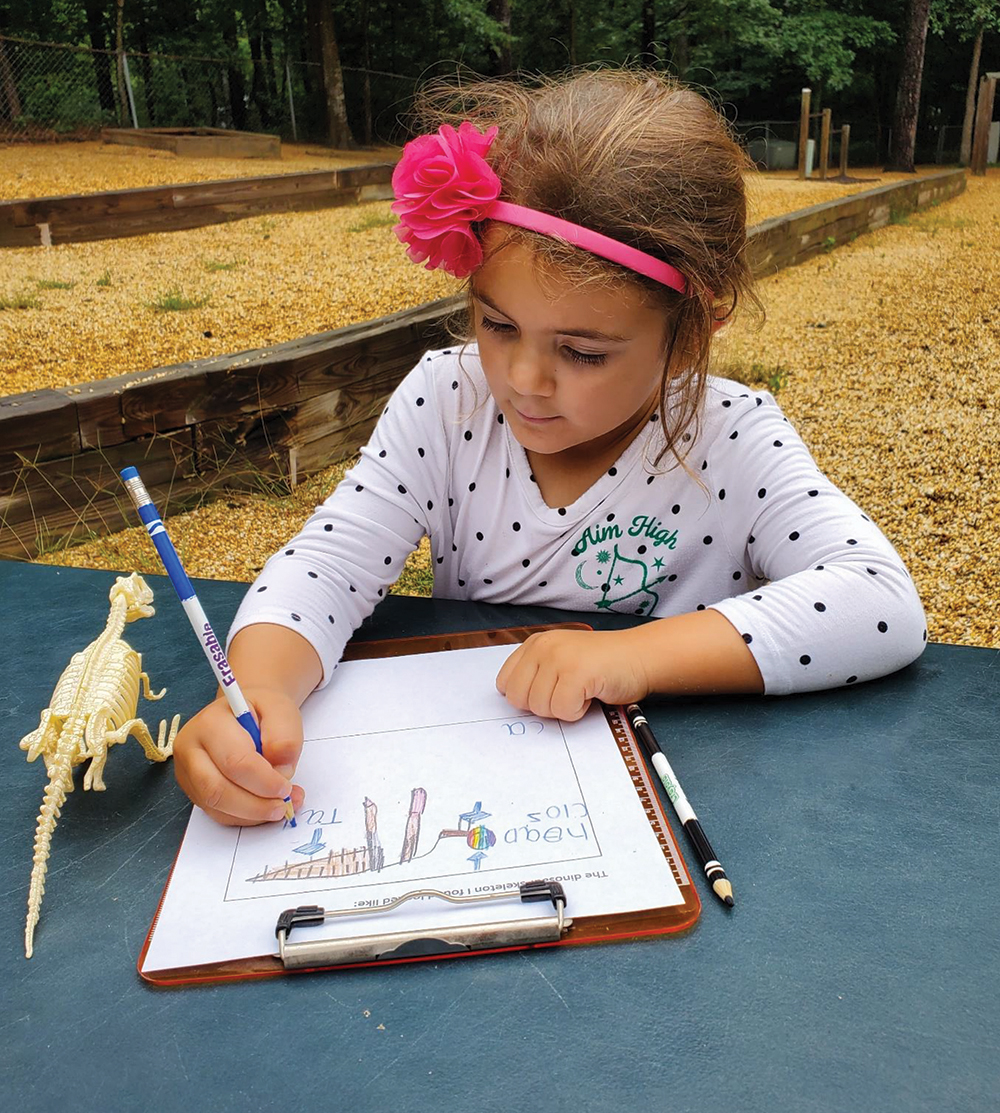 A student works to label her model drawing.