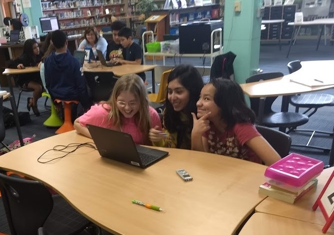 girls designing rain garden