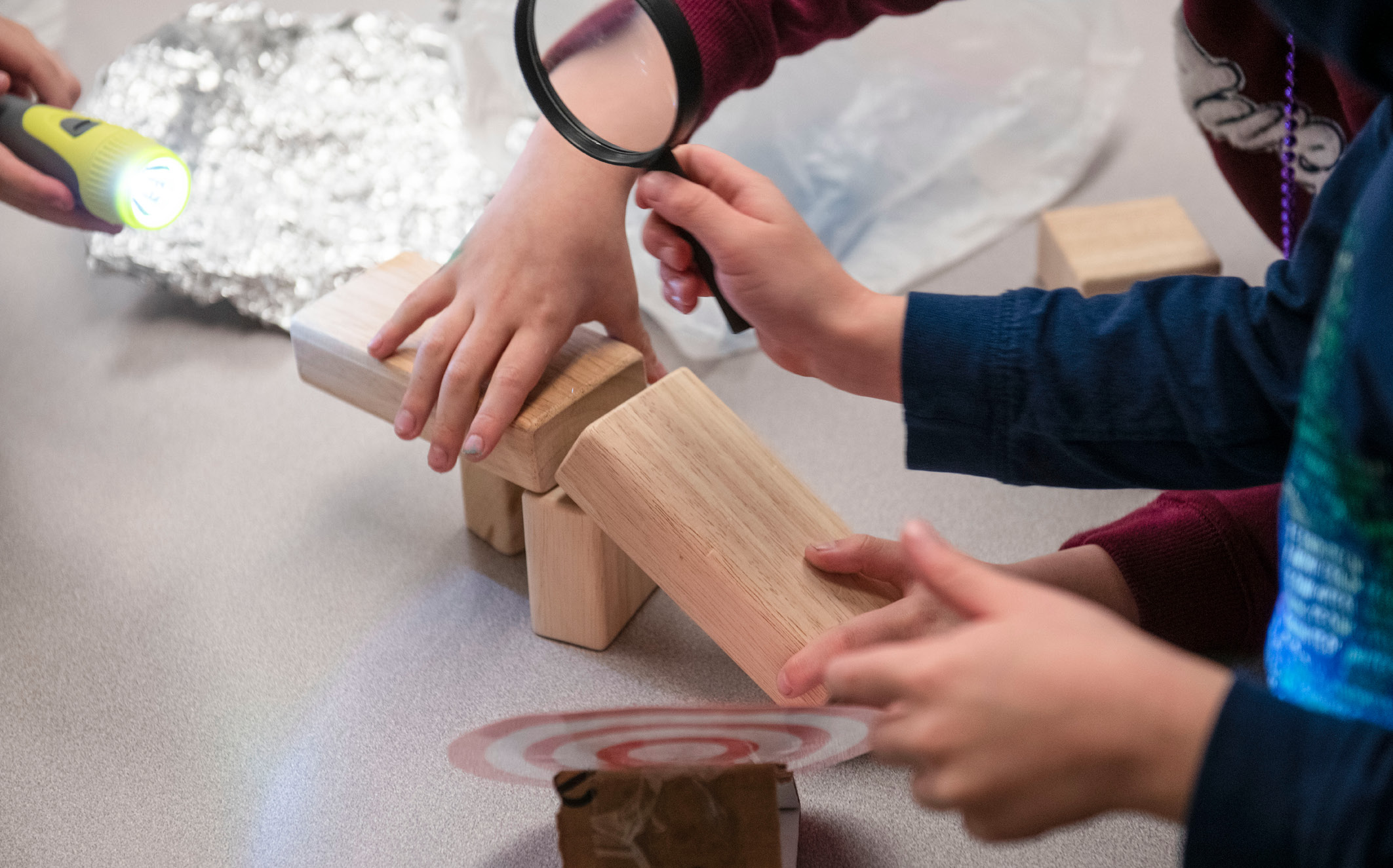 This "obstacle course" for light included blocks, aluminum foil, a magnifying glass, and a target.