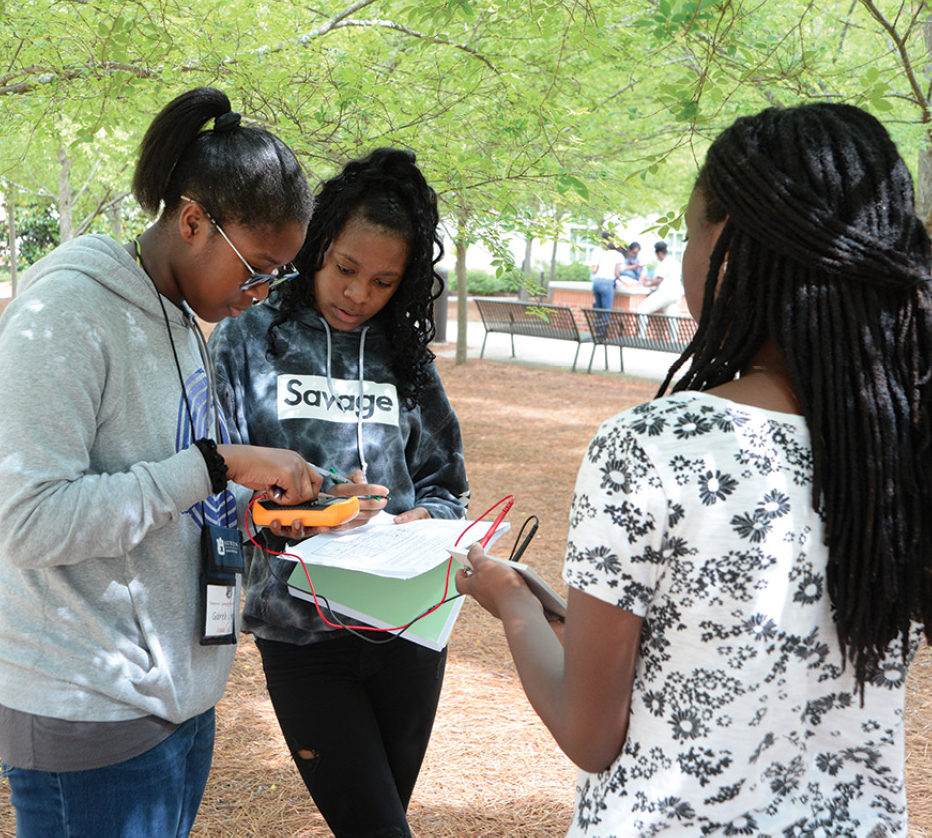 Students test their newly made solar cell.