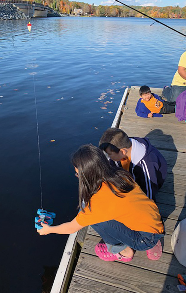 |	Figure 3: Students using sensors to measure water temperatures. 