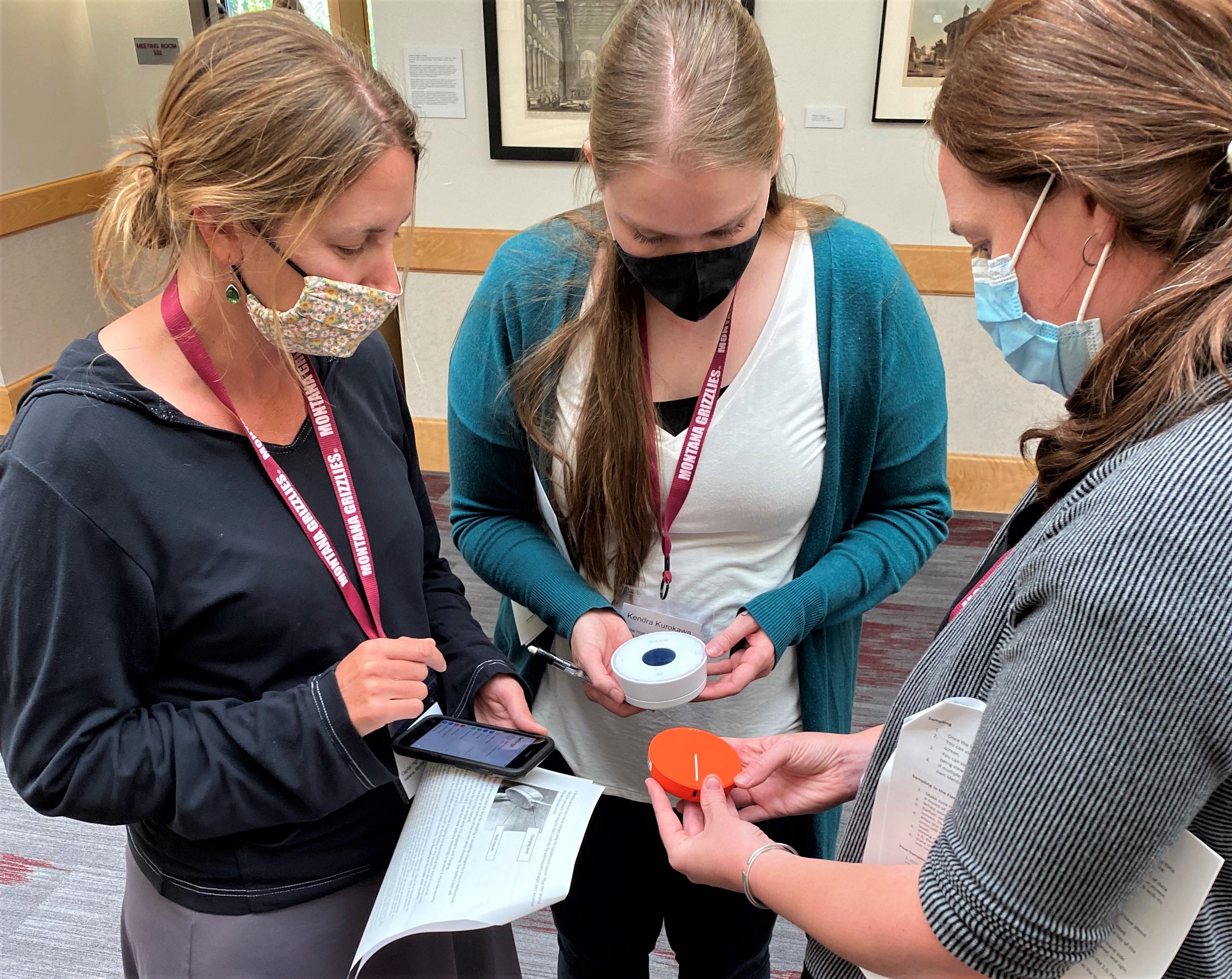 Teachers work with Wynd HALO monitors during the Summer Teacher Workshop