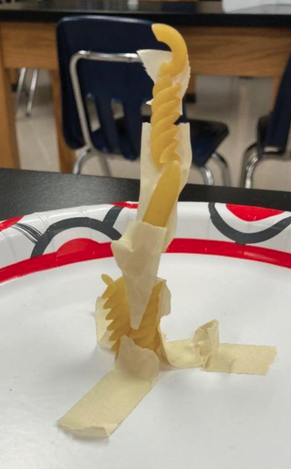 A sample tower constructed of pasta, avoiding the handling of materials by multiple students. 