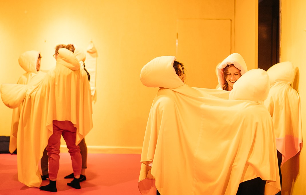 Visitors and staff explore the INTIMACY exhibition in Science Gallery at Trinity College Dublin. Only activated by two or more visitors, Huddlewear by artist Rhona Byrne encourages strangers to interact without technology in the gallery space. 