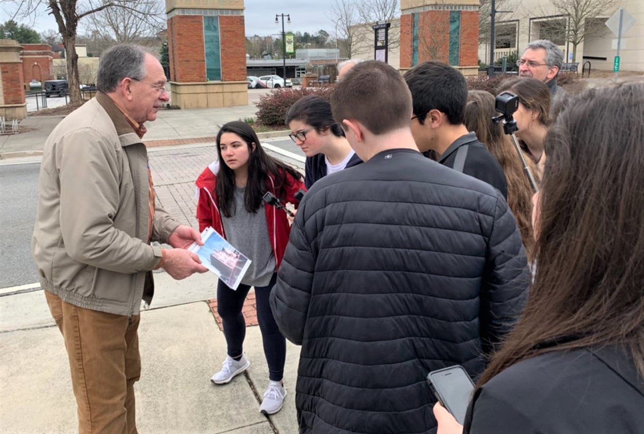 The mayor of a small town in the southeastern United States talks with public high school students and teachers about processes of community development. 