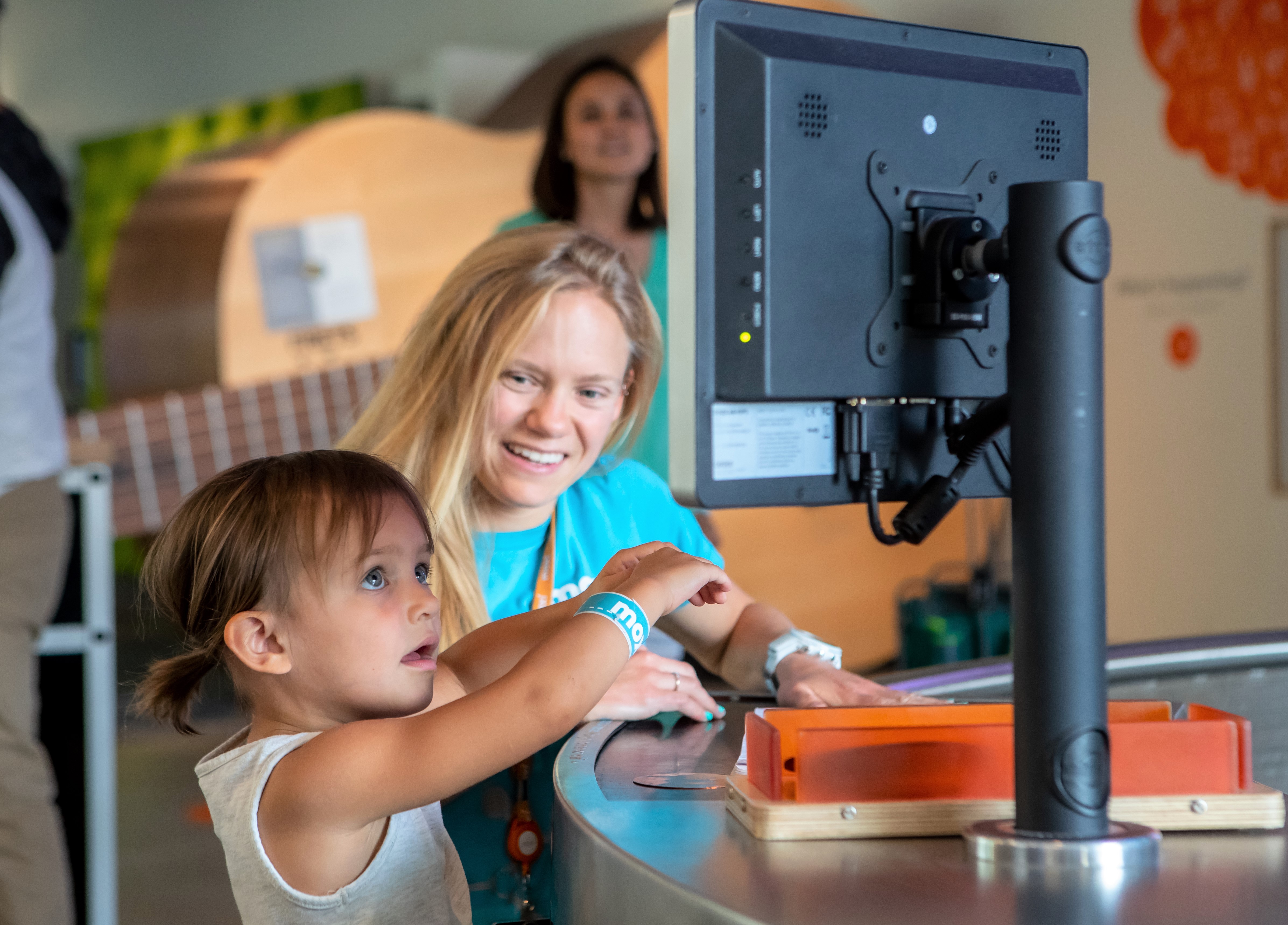 child interacting in a museum