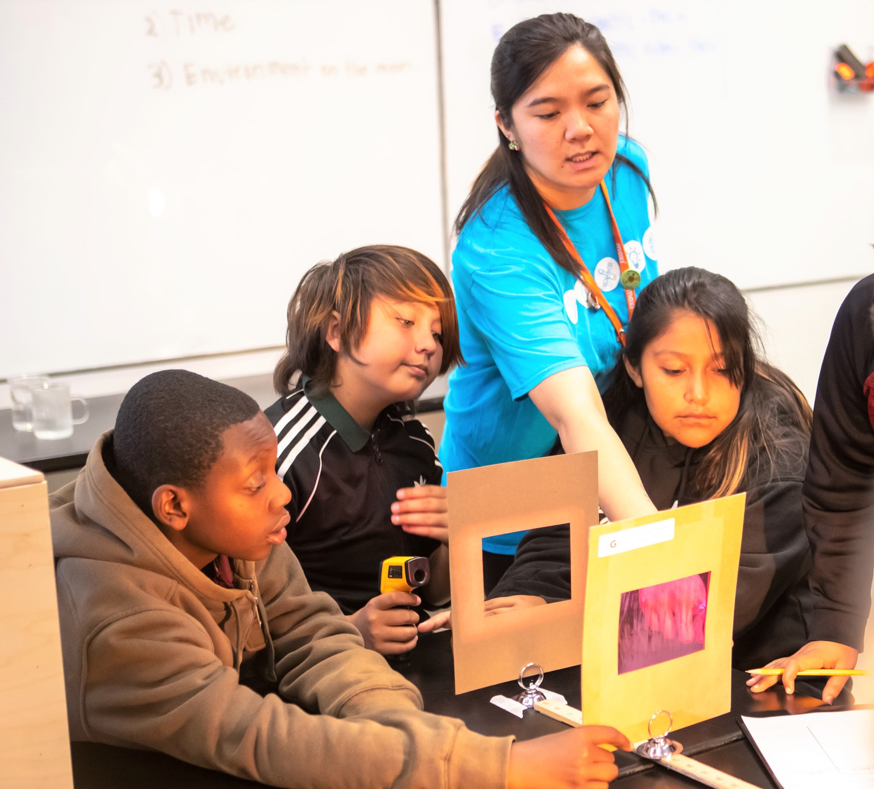 A MOXI educator engages fifth grade students in an engineering design challenge to create a repair patch for a hypothetical lunar greenhouse.