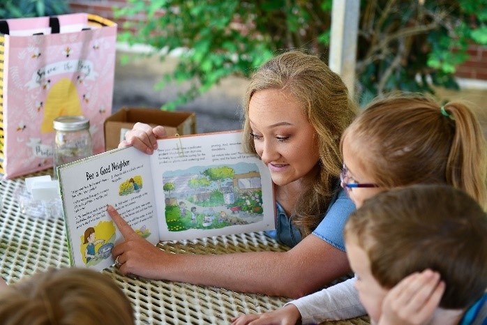 teacher reading to young children