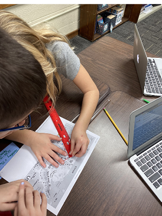 Students calculate distances to be traveled.