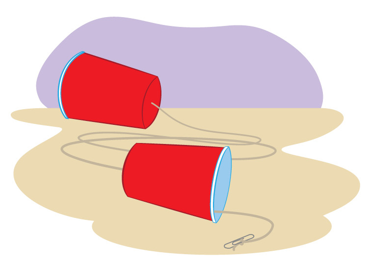 Each end of the string goes through a hole in the bottom of a cup and is tied to a paper clip. 