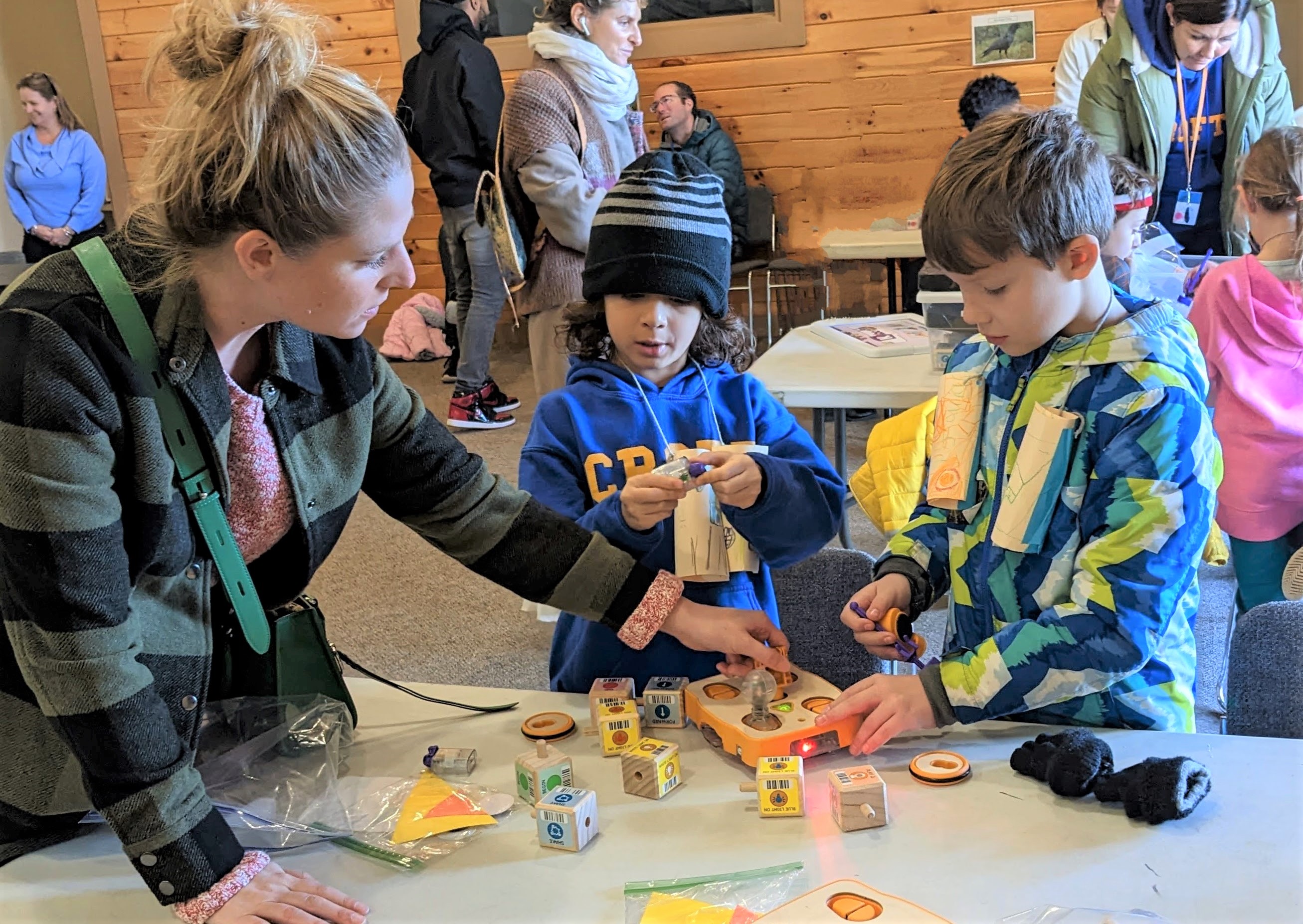 Figure 4. Students adding their extensions onto the robots to best mimic a local bird they observed