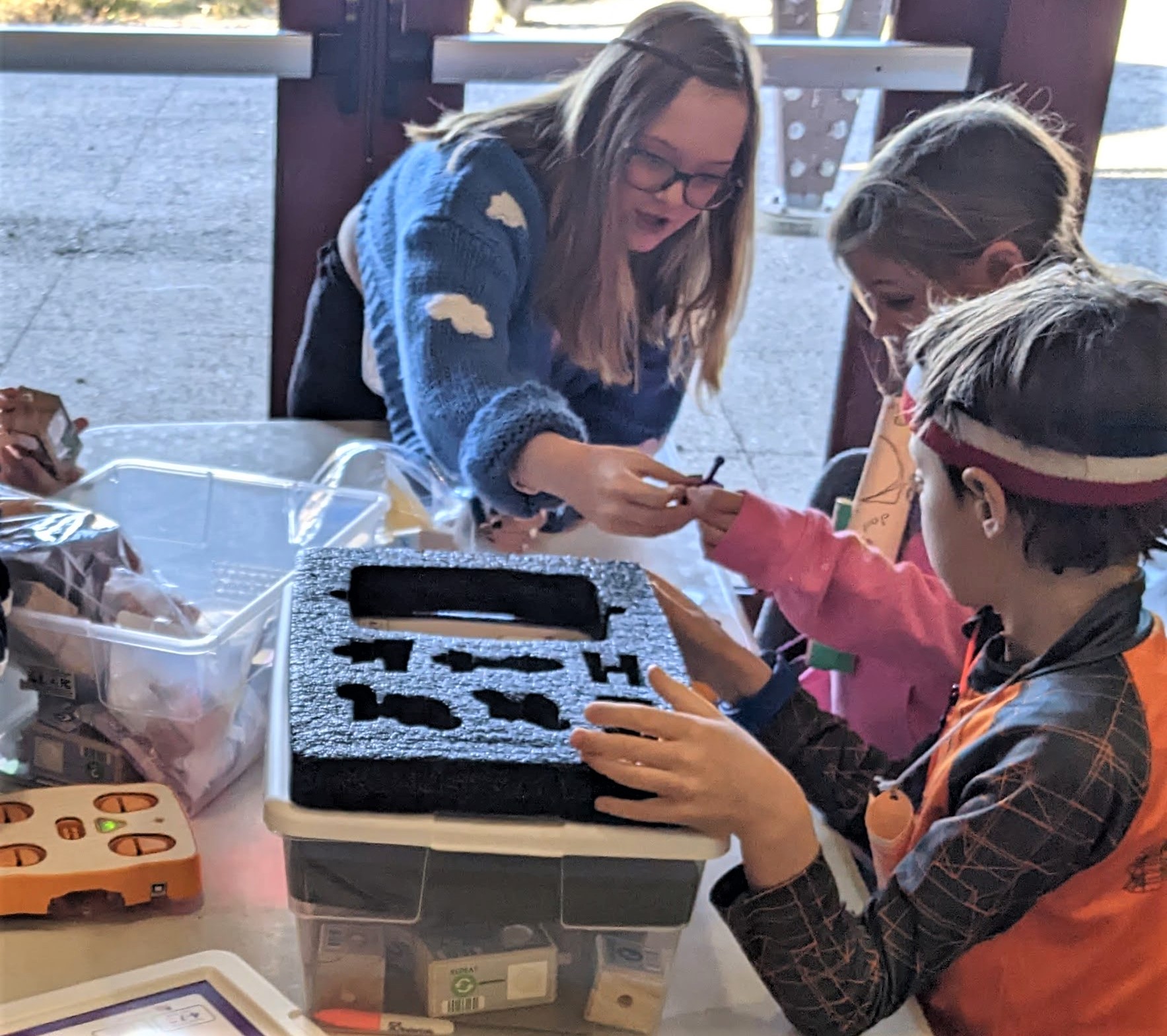 Figure 5. Preservice teacher assisting students in building the robots