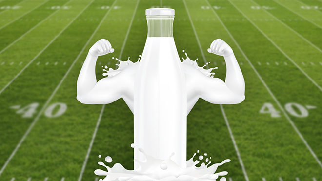 milk in the shape of muscles in front of a football field
