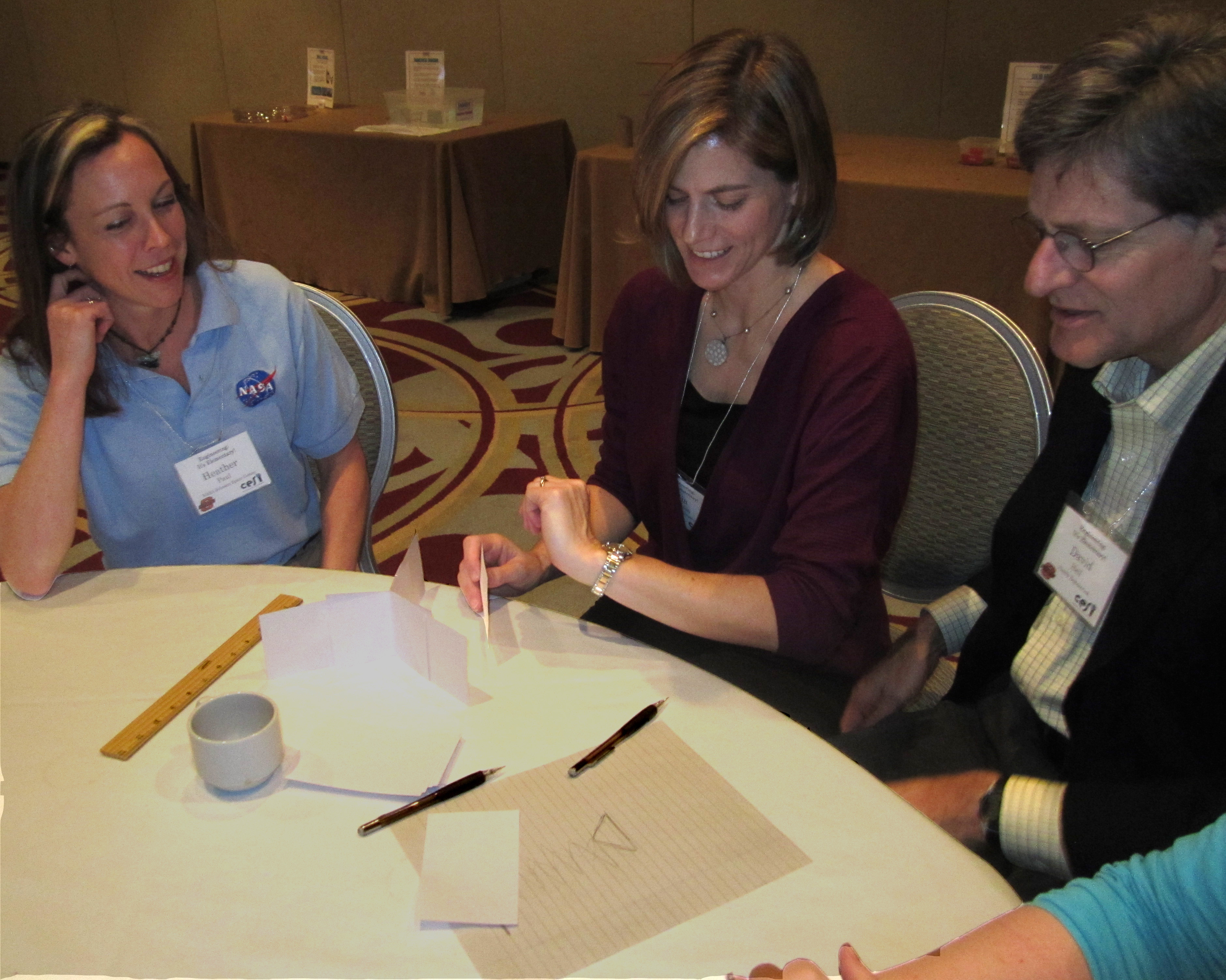 NASA engineer Heather Paul and Family Science & Engineering founders work on a design problem.