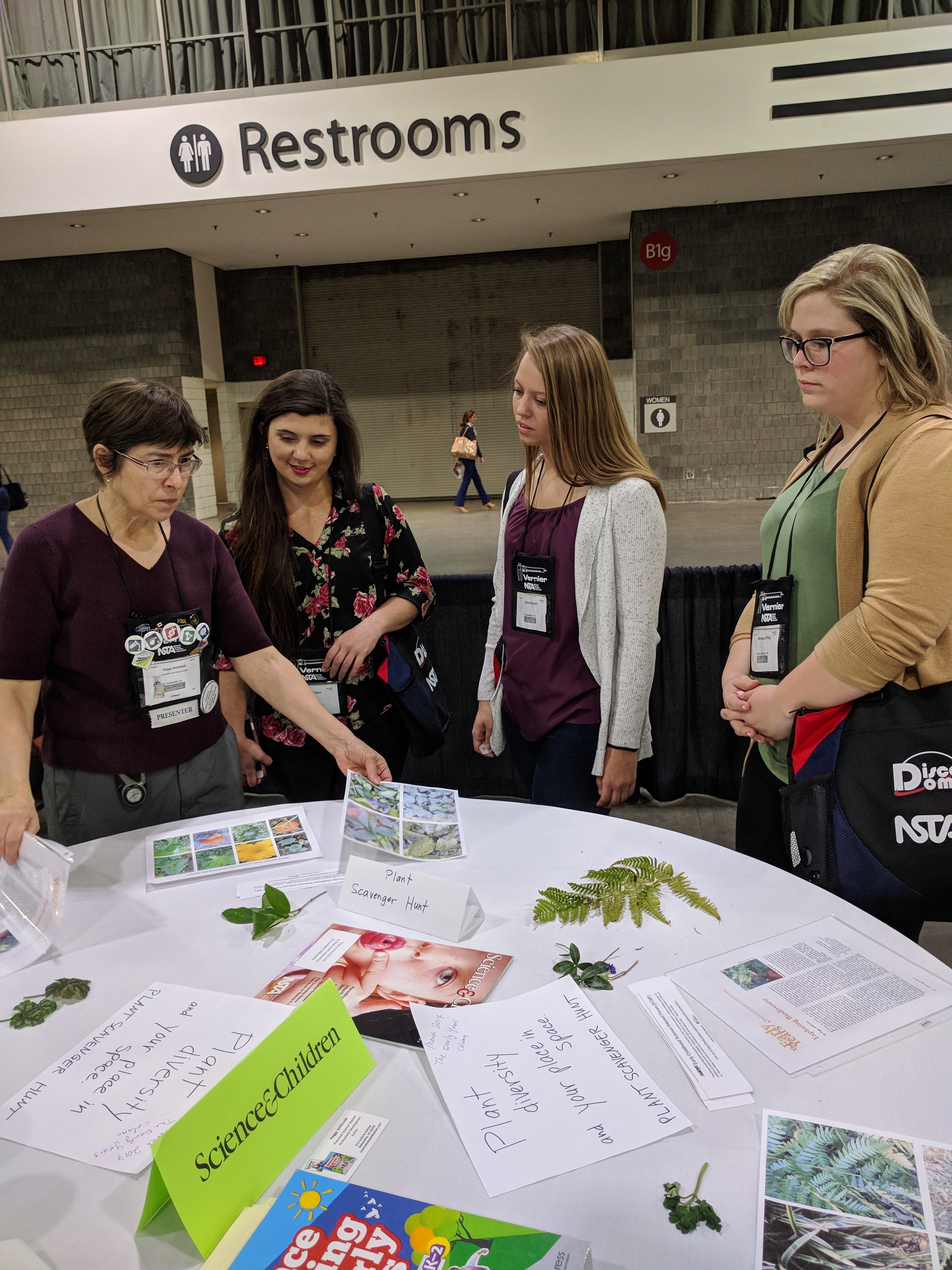 Peggy Ashbrook and participants discussing learning plant diversity through a plant scavenger hunt.