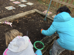 Children collecting earthworms from the school garden.