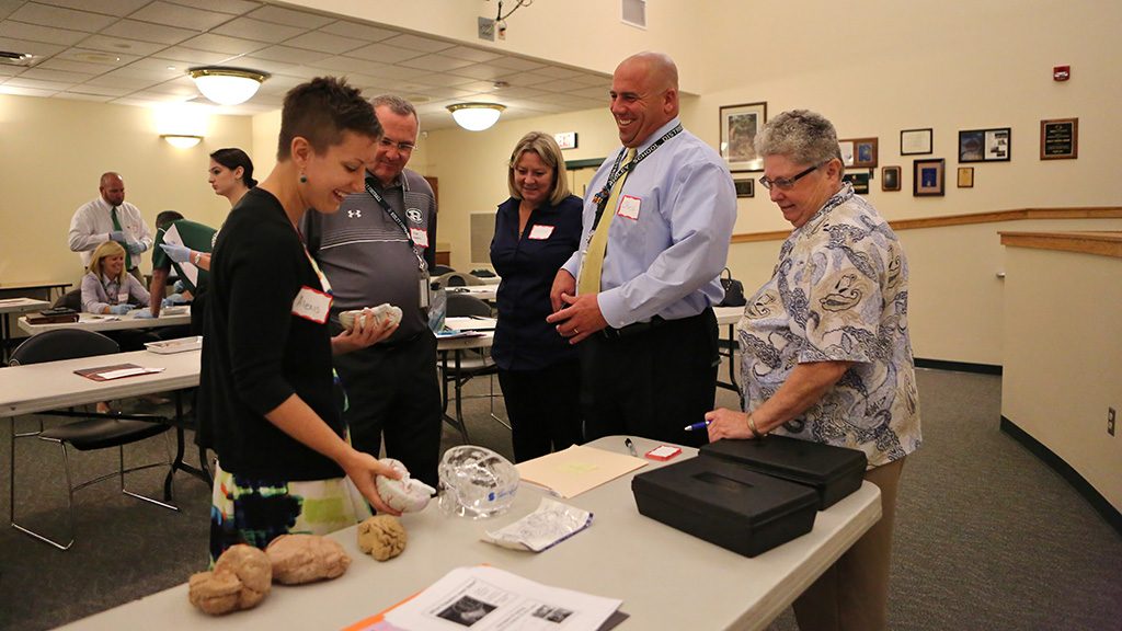 Teachers participate in workshops about understanding the brain.