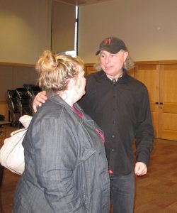 A project codirector speaks to a participant's parent.