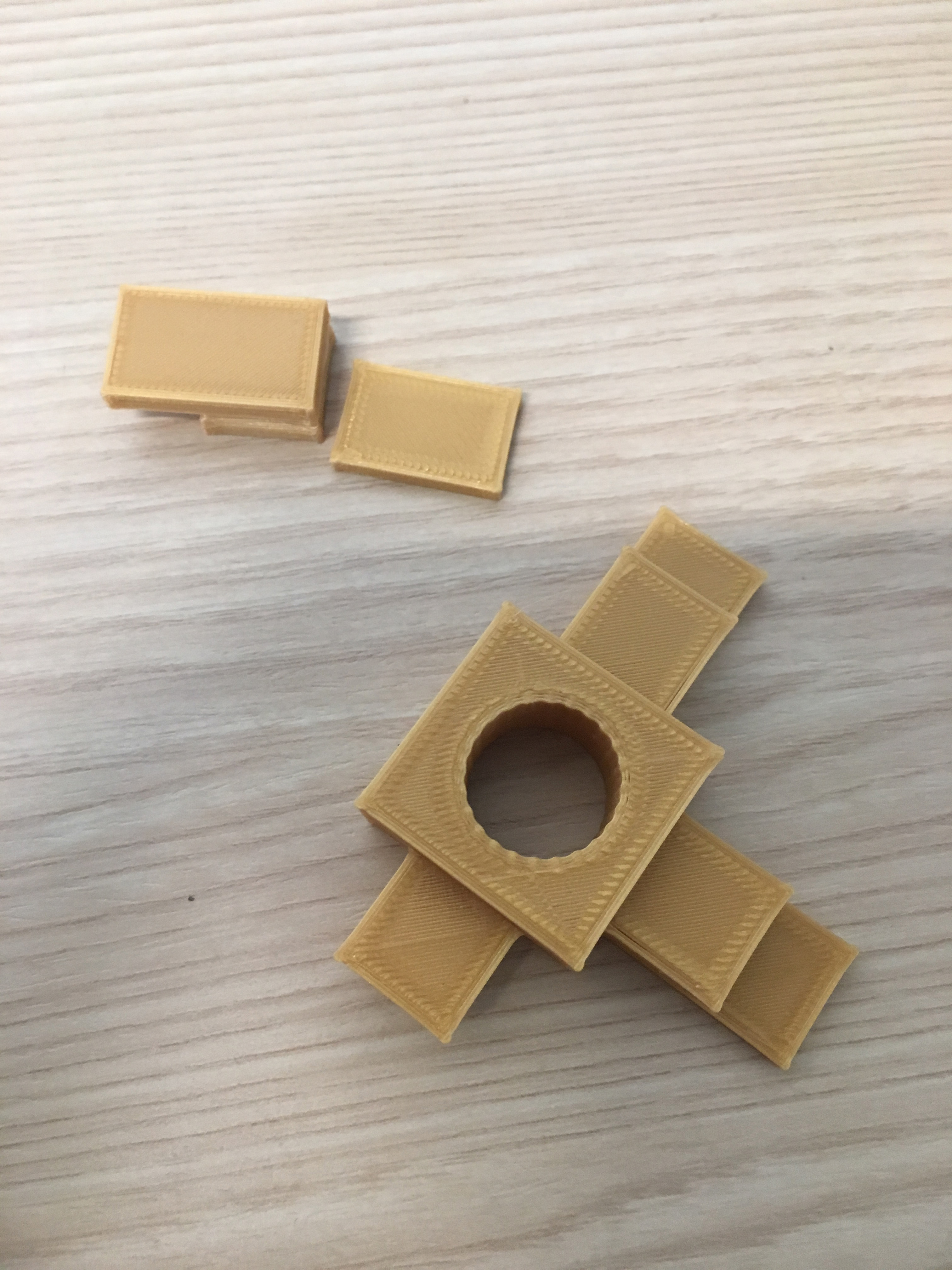 An example of a fidget that printed incorrectly. The center hole was too small to fit a bearing, and some of the edges were not properly attached to the fidget before printing.