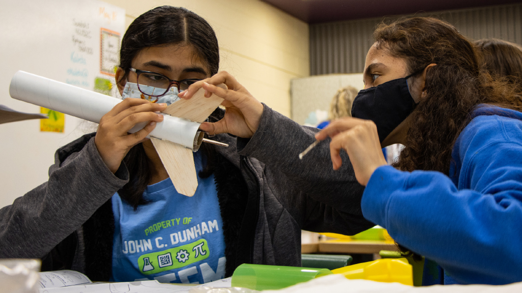 How can we plan a safe model rocket launch and landing?