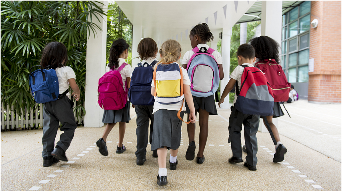 Young children walking together at school