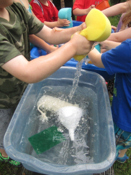 Children playing with sponges