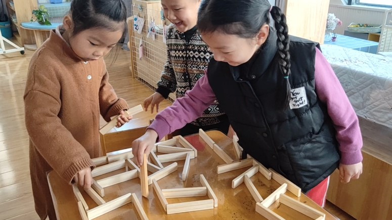 Children construct a hamster maze. 