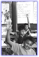 students raising their hands