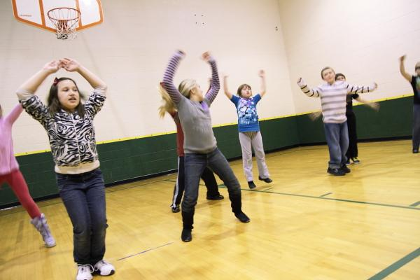 Kids doing jumping jacks