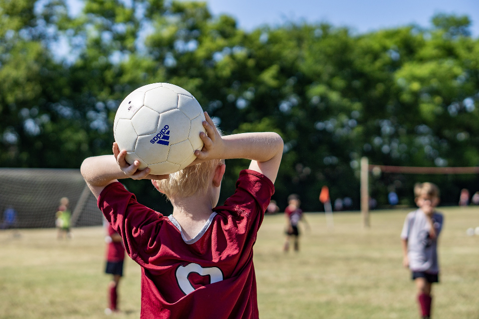 Boy Throwing a Soccer Ball