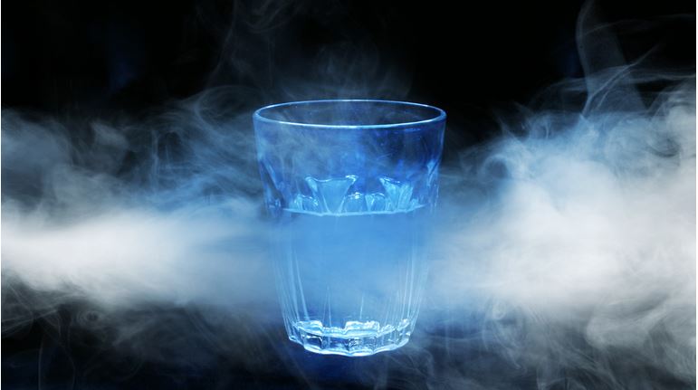 Glass of water in fog