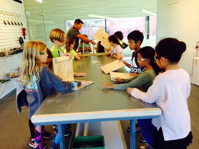 Students build high-resolution nesting boxes for the henhouse.