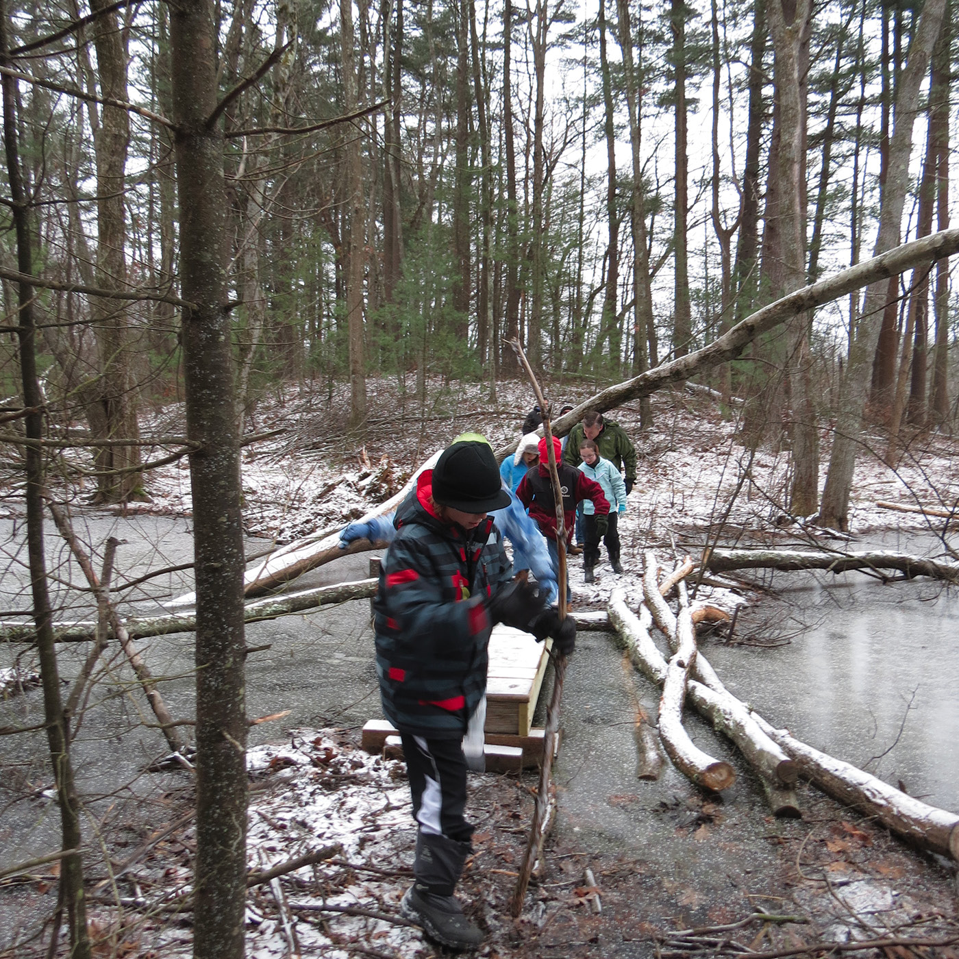 Students and their families braved the cold for a weekend hike in the swamp.