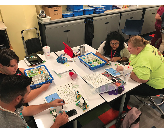 teachers around a table working on an activity