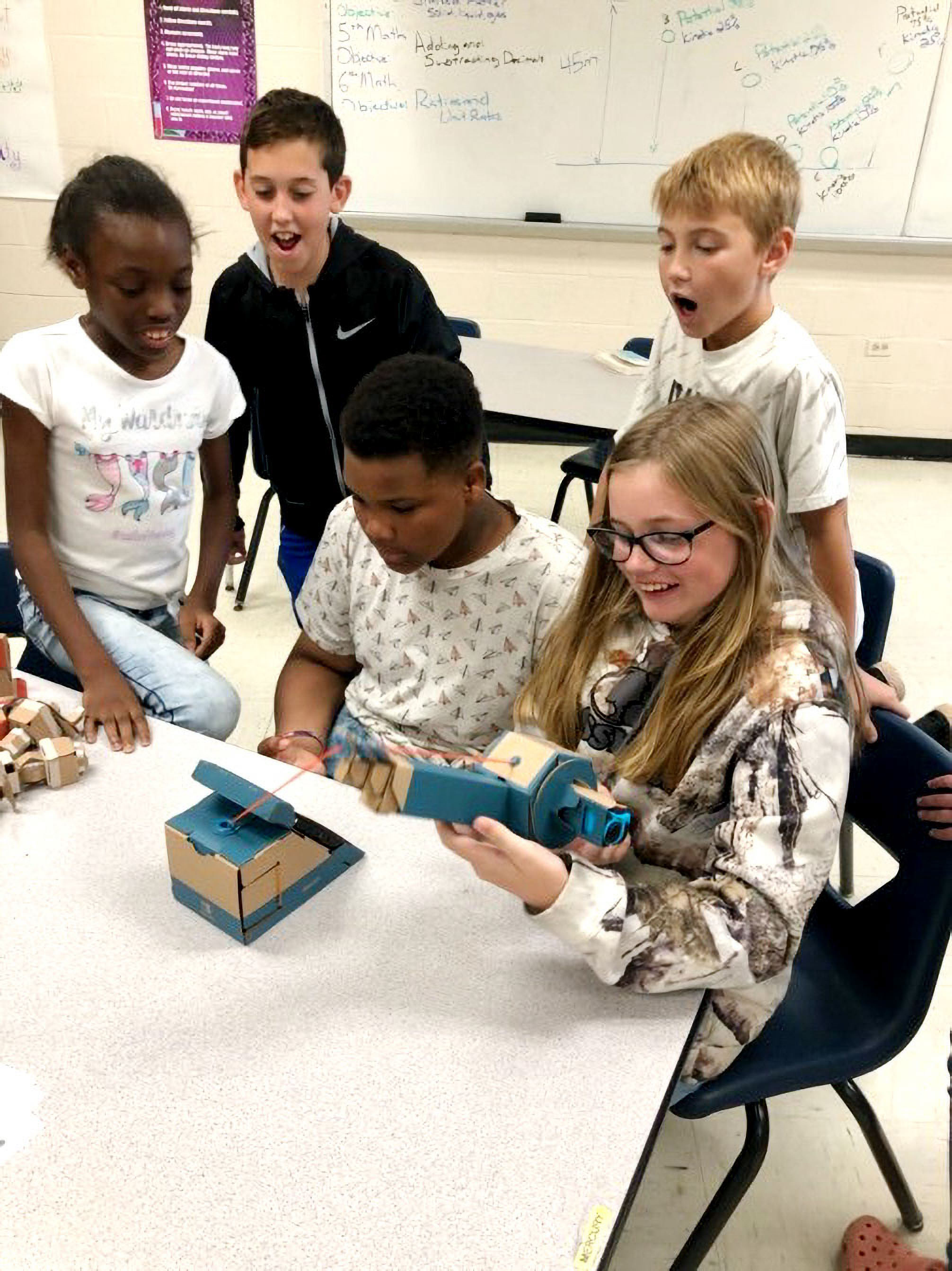 The group reels in a virtual fish.