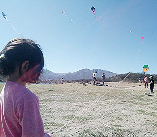 Flying kites with our families.