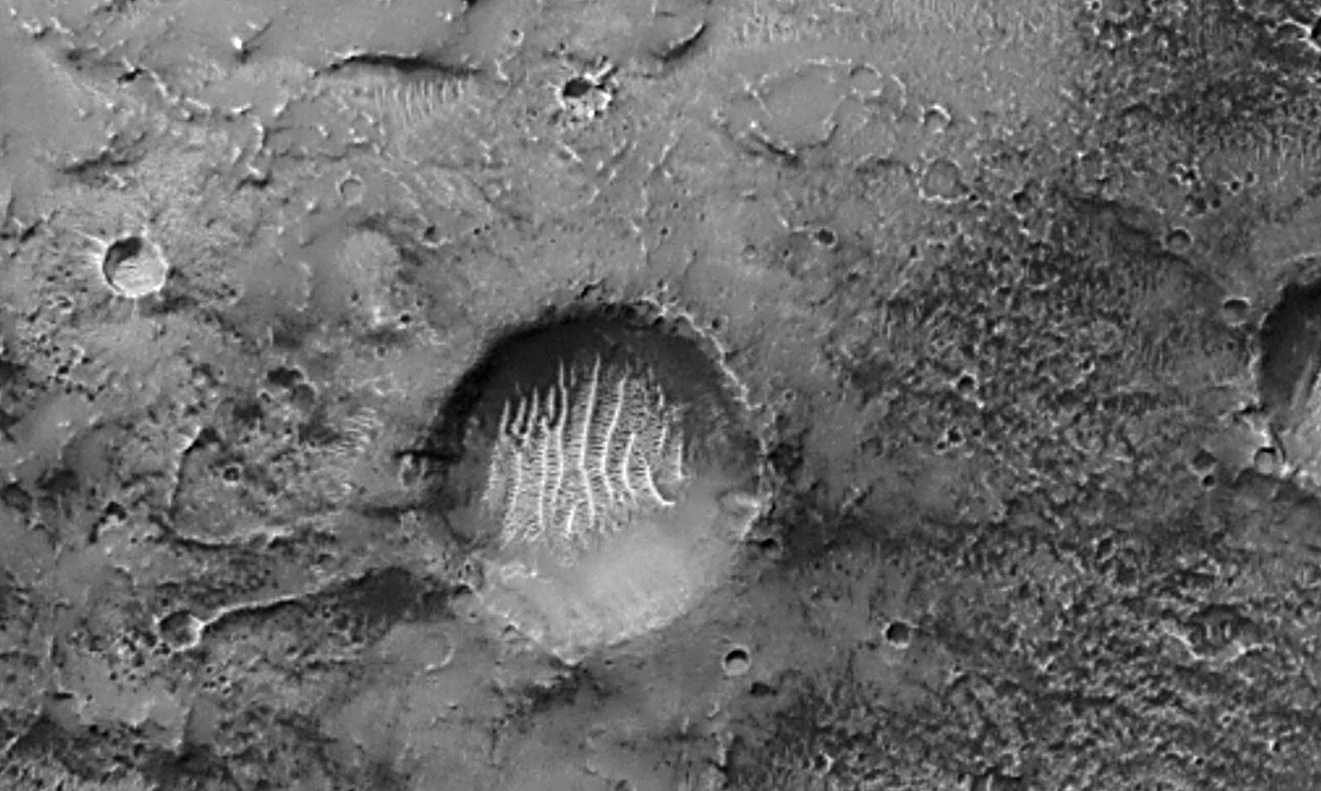 Figure 1 Mars Global Surveyor image of Airy-0 and nearby area (mars.nasa.gov/mgs/msss/camera/images/01_31_01_releases/airy0)