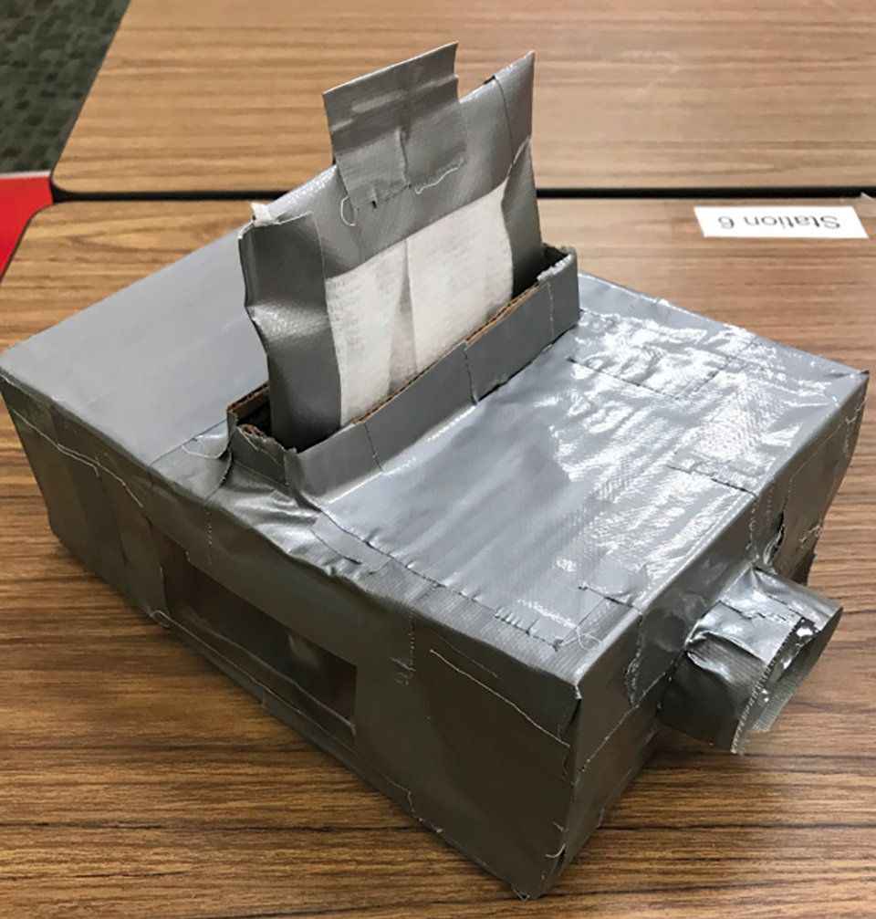 Figure 2 Sample air filter made by middle school students. The air filter is equipped with a removable filter to fit in the testing box.