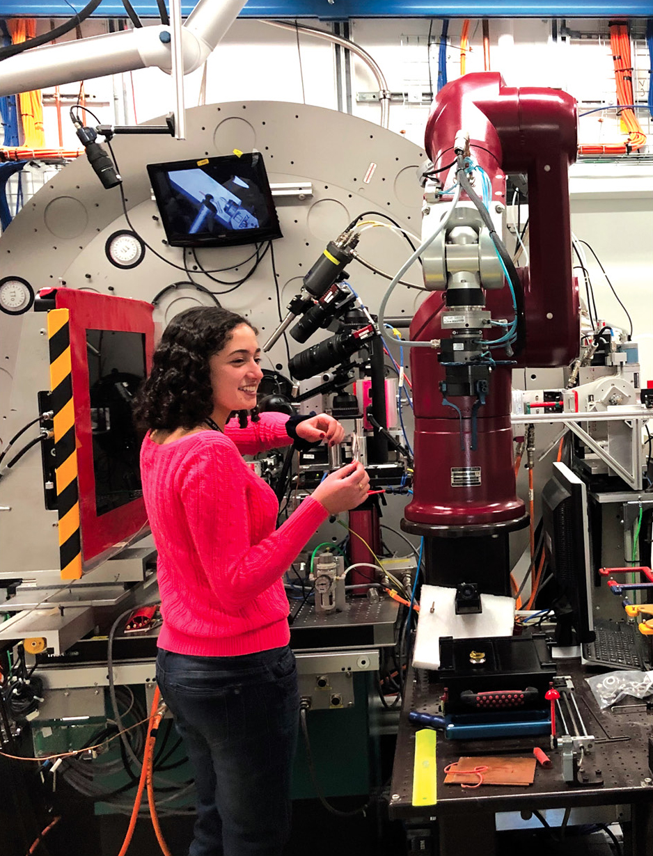 Figure 2. SPARK student Madison Esposito mounts a micrometeorite sample into the XPD beamline for analysis by X-ray diffraction. Students followed all required safety protocols and training for use of the instruments at the beamline. 